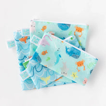 Load image into Gallery viewer, Bumkins Reusable Snack Bag, Small 2-Pack: Ocean Life & Whale Tail lays stacked on top of two other bags on a white background.