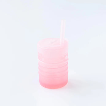 Bumkins Silicone Straw Cup with Lid: Pink sits on a white background.