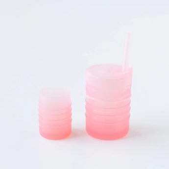 Bumkins Silicone Straw Cup with Lid: Pink sits next to another pink cup on a white background.