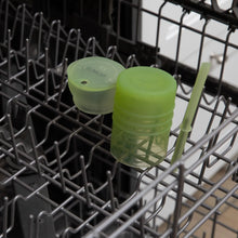 Load image into Gallery viewer, Bumkins Silicone Straw Cup with Lid: Sage sits in the top rack of an open dishwasher.
