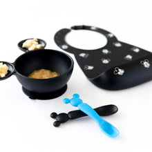 Load image into Gallery viewer, Bumkins Silicone Dipping Spoons: Mickey Mouse (Black and Blue) lay next to a black bowl of food and a black bib on a white background.