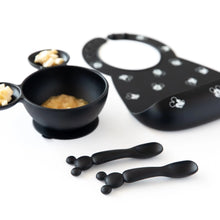 Load image into Gallery viewer, Bumkins Silicone Dipping Spoons: Mickey Mouse (Classic Black) lay in front of a black bowl of food and black bib on a white background.