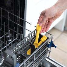 Load image into Gallery viewer, Hands place Bumkins Silicone Dipping Spoons: Winnie the Pooh in the utensil compartment of an open dishwasher.