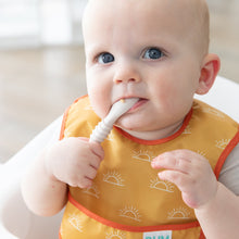 Load image into Gallery viewer, A baby wearing a yellow bib chews a Bumkins Silicone Dipping Spoons 3 Pack: Rocky Road while seated in a high chair.
