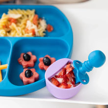 Load image into Gallery viewer, Close-up of a blue plate with pasta and fruit, with a Bumkins Silicone Chewtensils®: Dark Blue in a purple cup with berries and yogurt.