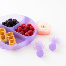 Load image into Gallery viewer, A purple plate holds waffles and berries with a heart-shaped bowl and Bumkins Silicone Chewtensils®: Purple Jelly nearby on a white background.