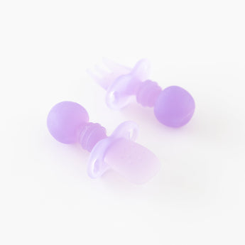Bumkins Silicone Chewtensils®: Purple Jelly are displayed on a white background with one face-down, showcasing sensory bumps on the back.