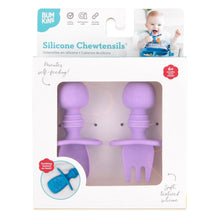 Load image into Gallery viewer, Bumkins Silicone Chewtensils®: Lavender are shown in a white packaging box, with a clear front window displaying the product.