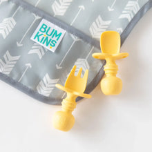 Load image into Gallery viewer, Close-up of Bumkins Silicone Chewtensils®: Pineapple on top of a gray arrow-print bib on a white background.