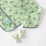 Bumkins Silicone Chewtensils®: Sage rest next to a green llama-patterned bib on a white background.