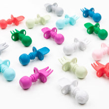 Load image into Gallery viewer, Bumkins Silicone Chewtensils®: Fuchsia are neatly arranged among other toddler utensil sets on a white background.