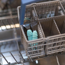 Load image into Gallery viewer, Bumkins Spoon + Fork: Blue sits in the utensil compartment of an open dishwasher.
