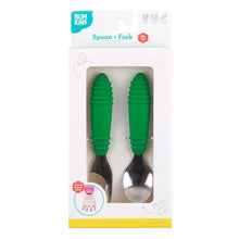 Load image into Gallery viewer, Bumkins Spoon + Fork: Jade is shown in a white packaging box with a clear front window displaying the set of utensils.