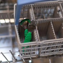 Load image into Gallery viewer, Bumkins Spoon + Fork: Jade sits in the utensil compartment of an open dishwasher.