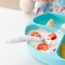 Load image into Gallery viewer, Close-up of Bumkins Spoon + Fork: Vanilla Sprinkle in a blue sectioned plate filled with yogurt and fruit on a white table.
