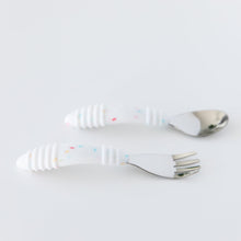 Load image into Gallery viewer, Bumkins Spoon + Fork: Vanilla Sprinkle lay horizontally on a white background.
