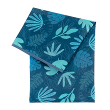 Load image into Gallery viewer, Bumkins Splat Mat: Blue Tropic is a dark blue waterproof mat with a blue and teal leaf pattern and blue trim.