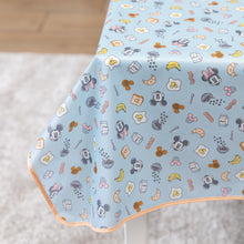 Load image into Gallery viewer, Bumkins Splat Mat: Mickey + Minnie Sunny Side Up, featuring a pastel blue base with Mickey faces and vibrant foods, is laid over a table.