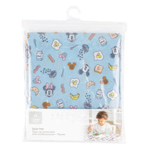 Load image into Gallery viewer, Bumkins Splat Mat: Mickey + Minnie Sunny Side Up is shown folded in plastic packaging bag with a hanger and cardboard insert.