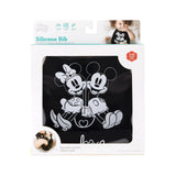 Bumkins Silicone Bib: Mickey + Minnie Mouse is shown in a white packaging box with a clear front window displaying the bib.
