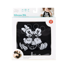 Load image into Gallery viewer, Bumkins Silicone Bib: Mickey + Minnie Mouse is shown in a white packaging box with a clear front window displaying the bib.