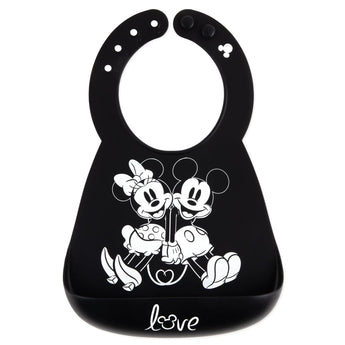 Bumkins Silicone Bib: Mickey + Minnie Mouse, made of black silicone, features a white illustration of Mickey and Minnie holding hands.