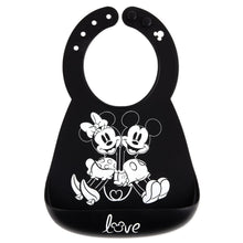 Load image into Gallery viewer, Bumkins Silicone Bib: Mickey + Minnie Mouse, made of black silicone, features a white illustration of Mickey and Minnie holding hands.