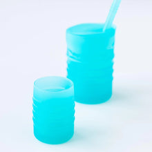Load image into Gallery viewer, Bumkins Silicone Starter Cup: Blue sits in front of a larger blue cup on a white background.