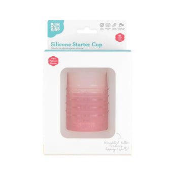 Bumkins Silicone Starter Cup: Pink is shown in a white packaging box, with a front window displaying the cup.