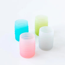 Load image into Gallery viewer, Four cups, including Bumkins Silicone Starter Cup: Pink, sit on a white background.