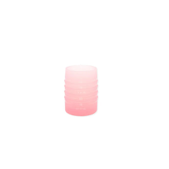 Bumkins Silicone Starter Cup: Pink is a cylindrical cup with measurements that helps baby's transition to open cup drinking.