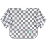 Bumkins Sleeved Bib: Charcoal Check features a gray and white checkered waterproof fabric, long sleeves, and a bottom pocket.