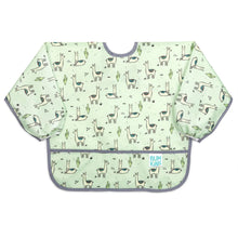 Load image into Gallery viewer, Bumkins Sleeved Bib: Llamas is a light green waterproof sleeved bib with a llama and cactus print, gray trim, and front pocket.