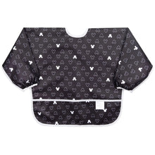 Load image into Gallery viewer, Bumkins Sleeved Bib: Mickey Mouse Icon Black + White is made of black waterproof fabric with a white Mickey Mouse icon design & white trim.