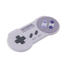 Load image into Gallery viewer, Bumkins Silicone Teether: Nintendo SNES™ Controller has a gray design, purple buttons, and directional pad for nostalgic gum relief.