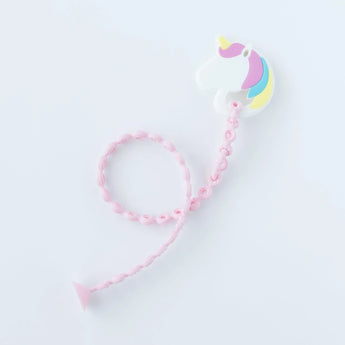 Bumkins Silicone Teether: Unicorn is attached to a pink silicone tether on a white background.