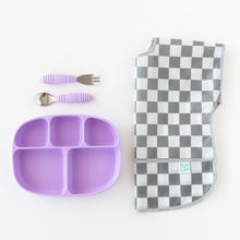 Load image into Gallery viewer, A purple baby plate with matching fork and spoon and and Bumkins Junior Bib: Charcoal Check on a crisp white background.