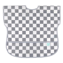 Load image into Gallery viewer, Bumkins Junior Bib: Charcoal Check features gray and white checkered, easy-wipe waterproof fabric, with pocket at the bottom.