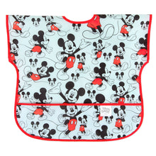 Load image into Gallery viewer, Bumkins Junior Bib: Mickey Mouse Classic features Mickey Mouse illustrations on light blue waterproof fabric with red trim and front pocket.