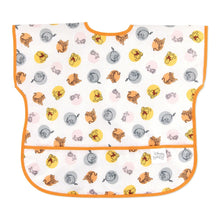 Load image into Gallery viewer, Bumkins Junior Bib: Winnie and Friends is made of white waterproof fabric with a colorful character design, orange trim, and front pocket.
