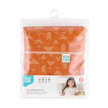 Load image into Gallery viewer, Bumkins Short-Sleeved Smock: Grounded is shown folded in plastic packaging bag with a hanger and cardboard insert.