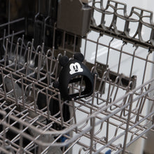 Load image into Gallery viewer, Bumkins Silicone Un-Droppable Mitt Teether: Mickey Mouse sits in the top rack of an open dishwasher.