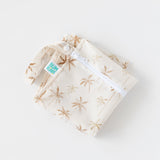 Bumkins Wet Bag: Palm Daze lays folded on a white background.