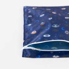 Load image into Gallery viewer, Bumkins Wet Bag: Evil Eye lays flat on a white background, partially open.