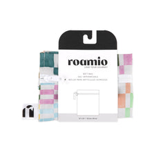 Load image into Gallery viewer, Roamio by Bumkins Wet Bag: Motley Check is shown folded in black & white cardboard packaging.