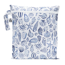 Load image into Gallery viewer, Roamio by Bumkins Wet Bag: Shells is a white waterproof pouch with a blue shell pattern, zipper closure, and side handle.