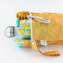 Load image into Gallery viewer, Bumkins Wet Bag: Sunshine, shown from the side, holds a water bottle, teal towel, and sun-printed sandals on a white background.