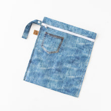 Load image into Gallery viewer, Roamio by Bumkins Wet Bag: Vintage Denim lays flat on a white background.
