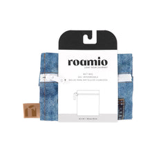 Load image into Gallery viewer, Roamio by Bumkins Wet Bag: Vintage Denim is shown folded in black & white cardboard packaging.