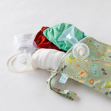 Bumkins Wet Bag: Camp Gear holds breast pump parts and cloth diapers on a white background.